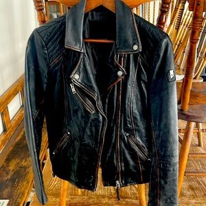 Unique brown leather jacket purchased at a boutique in PEC.